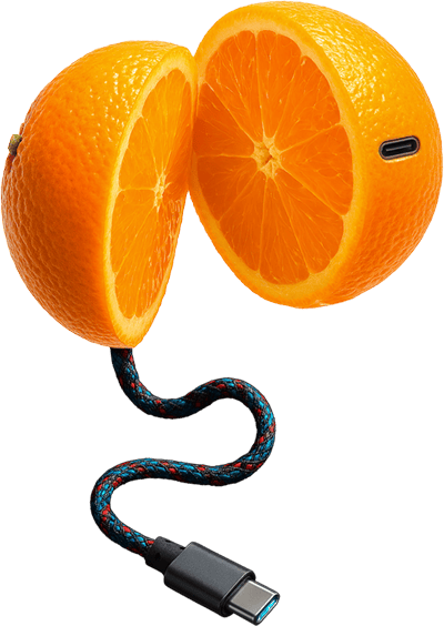 Naranja partida con cable USB-C en imagen conceptual generada con IA